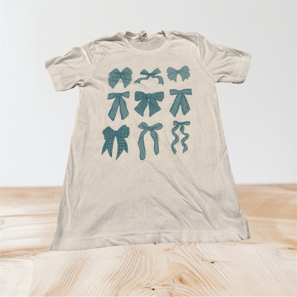 Bella Canvas adult Small short sleeve Tee with Blue Bow Patterns. Never worn.